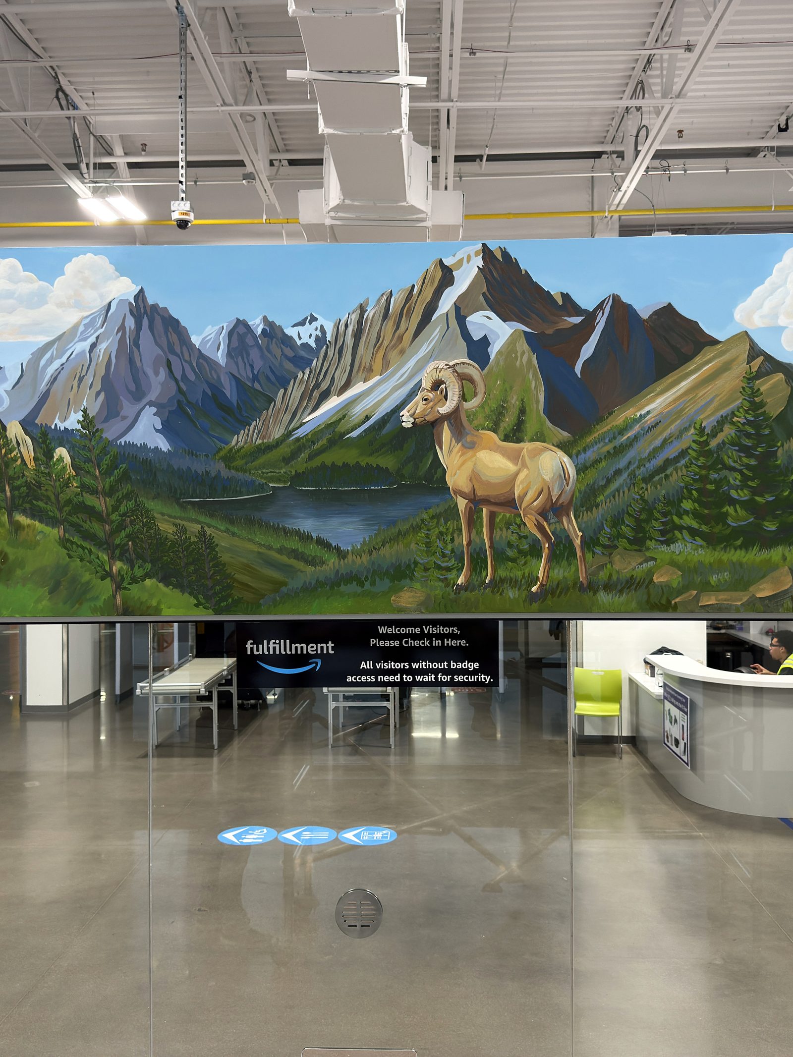 The finished visitor entrance mural, a high alpine lake with a bighorn ram at close to life size
